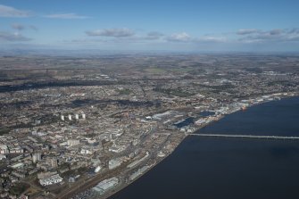 General oblique aerial view of Dundee centred on Tay Bridge Railway Station and the Tay Road Bridge, looking NE.