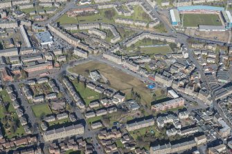 Oblique aerial view of The Hilltown, SS Peter and Paul Roman Catholic Church and Dens Park, looking NNE.