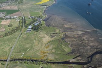 General oblique aerial view of Dalmore Distillery and pier, looking NW.