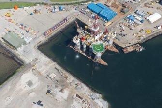 Oblique aerial view of Invergordon oil rig service base, looking NW.