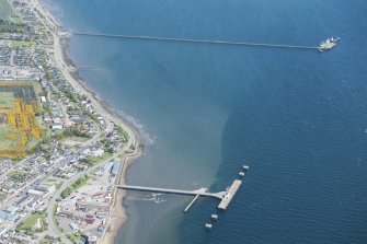 Oblique aerial view of Invergordon East Pier, looking NW.