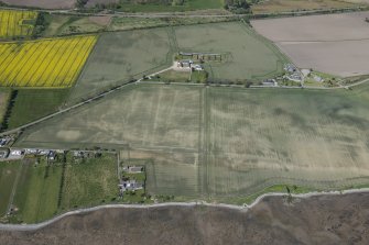 Oblique aerial view of the soilmarks at Polnico, looking NW.