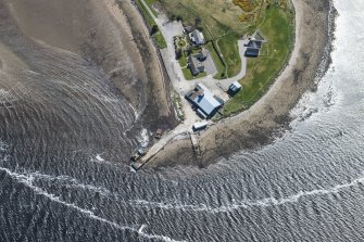 Oblique aerial view of the piers at Meikle Ferry, looking S.