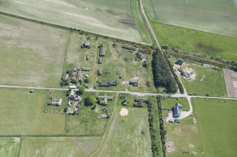Oblique aerial view of Fearn Airfield accomodation camp, looking SE.