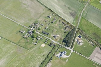 Oblique aerial view of Fearn Airfield accomodation camp, looking ESE.