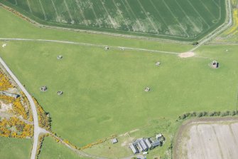 Oblique aerial view of Fearn Airfield military camp, looking NW.