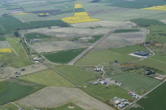 General oblique aerial view of Fearn Airfield, looking SW.