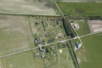 Oblique aerial view of Fearn Airfield accomodation camp, looking SE.