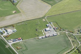 Oblique aerial view of Fearn Airfield military camp and operations block, looking E.