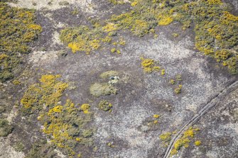 Oblique aerial view of the Heights of Brae chambered cairn, looking WSW.
