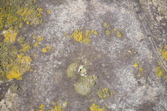 Oblique aerial view of the Heights of Brae chambered cairn, looking NW.