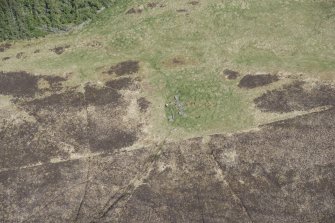 Oblique aerial view of the Balnacrae chambered cairn, looking NNE.