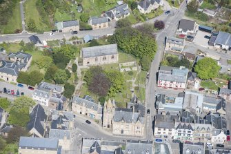 Oblique aerial view of St Duthus's Collegiate Church and Tolbooth in Tain, looking N.