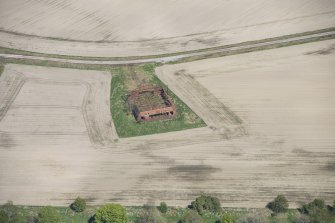 Oblique aerial view of a hangar at Fearn Airfield, looking ENE.