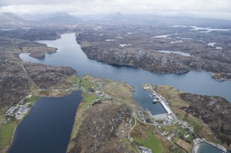 General oblique aerial view of Kinlochbervie with Loch Inchard beyond, looking SSE.
