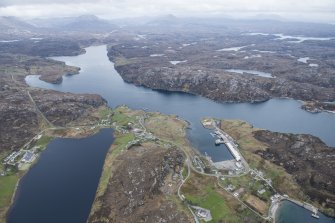 General oblique aerial view of Kinlochbervie with Loch Inchard beyond, looking SSE.