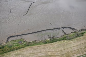 Oblique aerial view of fish traps near Balcladaich Wood on the Cromarty Firth, looking NW.
