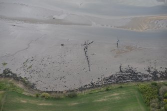 Oblique aerial view of fish traps in the Cromarty Firth, looking NW.