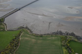 Oblique aerial view of fish traps in the Cromarty Firth, looking NW.