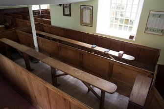 Durisdeer Parish Church. South Aisle View of communion box pews converted into communion tables from South West.