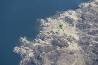 Oblique aerial view of buildings, a head dyke and lazy beds at Aird da Loch, looking ENE.