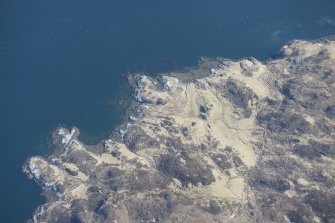 Oblique aerial view of buildings, a head dyke and lazy beds at Aird da Loch, looking ENE.