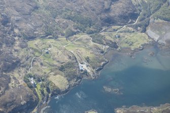 Oblique aerial view of a farmstead and head dyke at Loch Ardbhair, looking SE.