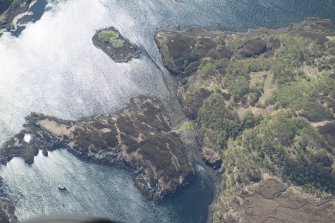 Oblique aerial view of a building and enclosure at Meallard, looking ESE.