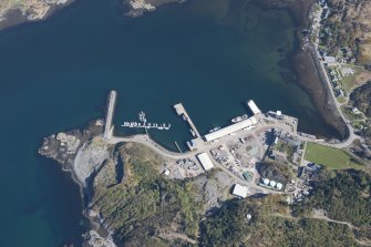 Oblique aerial view of Lochinver and Culag pier, looking N.