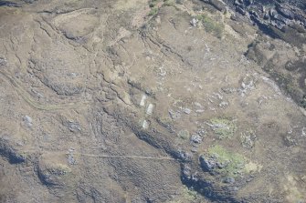 Oblique aerial view of Mellangaun gun emplacement, looking E.