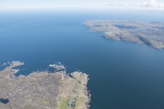 General oblique aerial view centred on Rubha nan Sasan with Slaggan Bay beyond, looking NE.