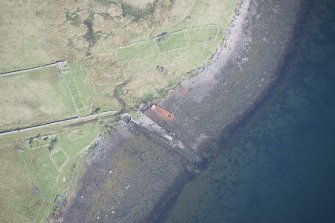 Oblique aerial view of a jetty at Gualann Mhor on the Isle of Ewe, looking NW.