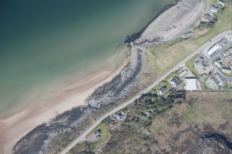 General oblique aerial view centred on Gairloch golf course, looking SE.