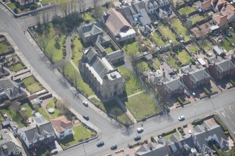Oblique aerial view of the Chapel of our Lady of the Assumption and St Meddan Church, looking S.