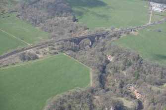 Oblique aerial view of Ballochmyle Railway Viaduct, looking NW.