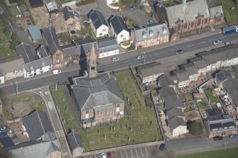 Oblique aerial view of Loudoun Old Parish Church and Newmilns Churchyard, looking N.