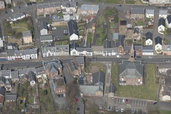 Oblique aerial view of Loudoun Old Parish Church, Newmilns Tower and Newmilns Churchyard, looking ESE.