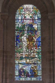 Stained glass window at west end on nave from east.