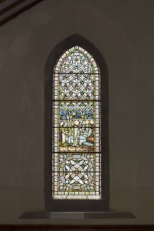 South aisle. Stained glass window on west wall.