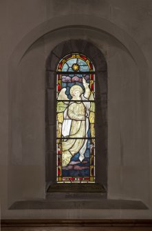 North aisle. Stained glass window.