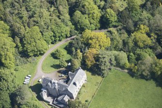 Oblique aerial view of Calder House, looking NE.