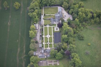 Oblique aerial view of Carlowrie Country House, walled garden, main stable block and Westfield Steading, looking ENE.