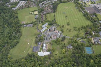 Oblique aerial view of Merchiston Castle School, including the main building and memorial hall, Colinton House, Chalmers Boarding House, Rogerson Boarding House, Engineer's Cottage, Colinton Castle and Laidlaw House, looking ENE.