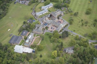 Oblique aerial view of Merchiston Castle School, including the main building and memorial hall, Colinton House, Chalmers Boarding House, Rogerson Boarding House, Engineer's Cottage, Colinton Castle and Laidlaw House, looking NE.