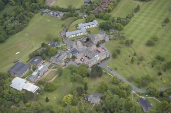 Oblique aerial view of Merchiston Castle School, including the main building and memorial hall, Colinton House, Chalmers Boarding House, Rogerson Boarding House, Engineer's Cottage, Colinton Castle and Laidlaw House, looking NNE.