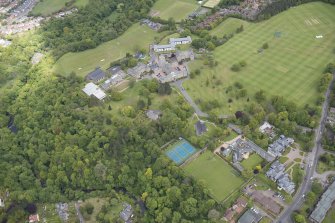 Oblique aerial view of Merchiston Castle School, including the main building and memorial hall, Colinton House, Chalmers Boarding House, Rogerson Boarding House, Engineer's Cottage, Colinton Castle, Sanatorium and Laidlaw House, looking N.
