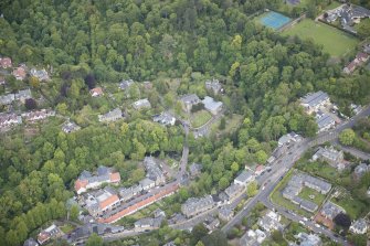 Oblique aerial view of Spylaw Street, Bridge Road and Colinton Parish Church, looking NNE.