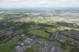 General oblique aerial view of the north west area of Edinburgh including Redford Infantry Barracks in the foreground, looking NW.