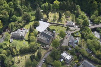 Oblique aerial view of Colinton Parish Church, burial ground and Colinton Manse, looking ESE.