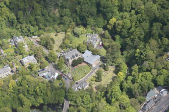 Oblique aerial view of Colinton Parish Church, burial ground and Colinton Manse, looking NE.